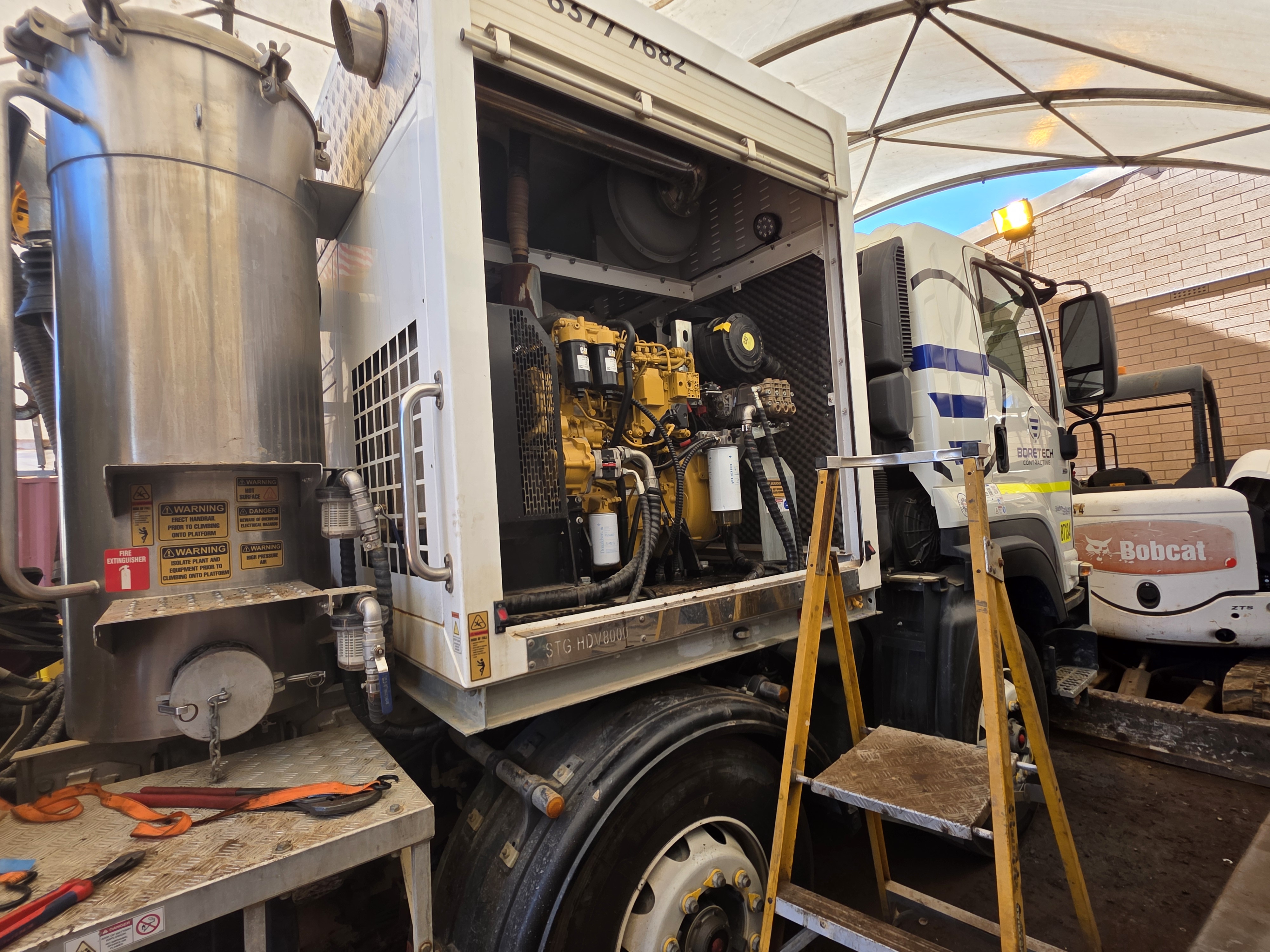 Walker's Australia technicians working in the workshop